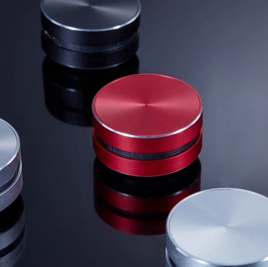 Mini bone conduction Bluetooth speaker in red and black, compact and portable, ideal for powerful wireless audio on the go.